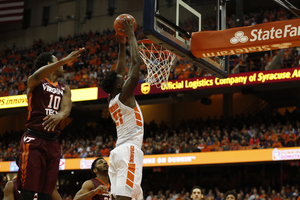 Syracuse forward Tyler Roberson leaps for a dunk against Virginia Tech on Jan. 2. 